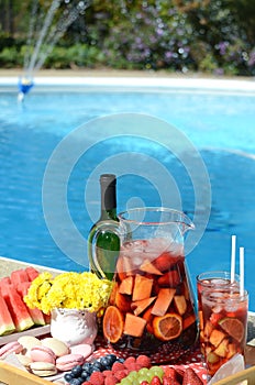 Pool party with sangria and cold alcoholic cocktails by the swimming pool