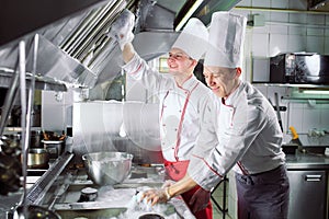 Sanitary day in the restaurant. Repeats wash your workplace. Cooks wash oven, stove and extractor in the Restaurant.