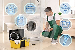 Sanitary engineering service. Plumber repairing washing machine in bathroom