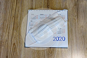 Sanitary mask and desktop, medical mask and calendar