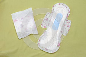 Sanitary napkins against a light green background