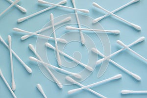 Sanitary themes - cotton sticks on blue background. Hygienic, medical concept