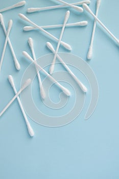 Sanitary themes - cotton sticks on blue background. Hygienic, medical concept