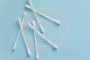 Sanitary themes - cotton sticks on blue background. Hygienic, medical concept