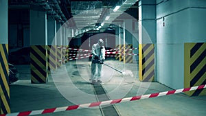 Sanitation worker is fumigating an empty unit