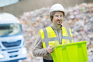Sanitation worker working in recycling plant