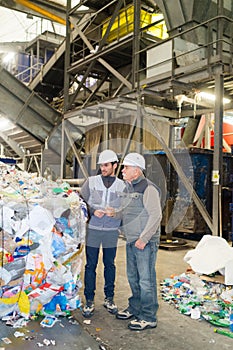 Sanitation workers in recycling plant