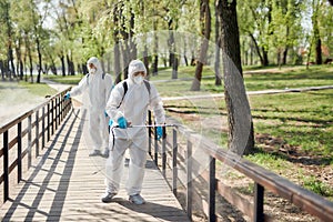 Cleaning Crew. Sanitization, cleaning and disinfection of the city park due to the emergence of the Covid19 virus photo