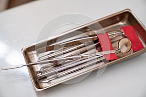 Sanitized metal tools for job of a dentist