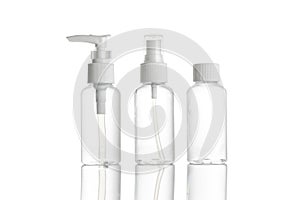 Sanitizer bottle. Empty clear plastic pump container for antiseptic gel, cosmetic soap and mineral shampoo isolated on