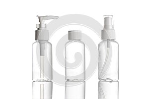 Sanitizer bottle. Empty clear plastic pump container for antiseptic gel, cosmetic soap and mineral shampoo isolated on white.