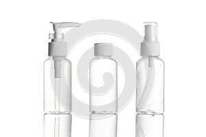 Sanitizer bottle. Empty clear plastic pump container for antiseptic gel, cosmetic soap and mineral shampoo isolated on white.