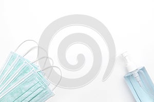 Sanitizer gel or antibacterial soap and medical surgical mask for coronavirus preventive measure on white background
