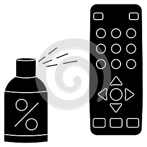 Sanitizing of TV remote. Remote disinfection. Disinfection of TV clicker using alcoholic spray. Sanitizing home items of daily use