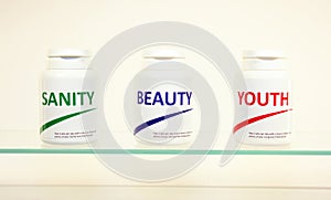 Sanity, Beauty and Youth pills in a bottle photo