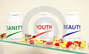 Sanity, Beauty and Youth pills in a bottle photo