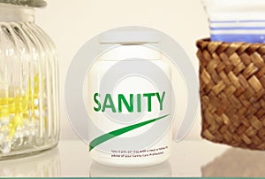 Sanity pills in a bottle on bathroom shelf photo