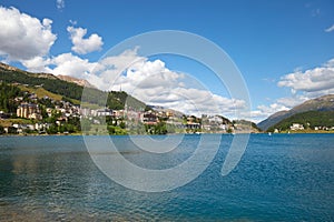Sankt Moritz town and blue lake in a sunny day in Switzerland photo