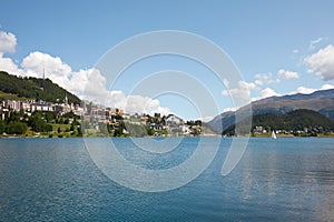 Sankt Moritz town and lake with boat in a summer day in Switzerland photo