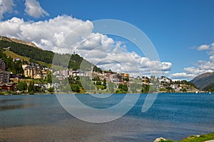 Sankt Moritz town, lake and green mountain in summer in Switzerland photo