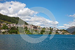 Sankt Moritz town and lake in a summer day, white clouds in Switzerland photo