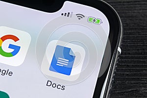 Google Docs icon on Apple iPhone X smartphone screen close-up. Google docs icon. Social network. Social media icon