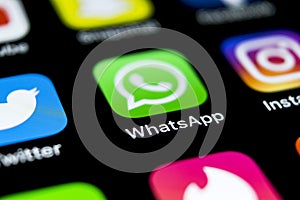 Whatsapp messenger application icon on Apple iPhone X smartphone screen close-up. Whatsapp messenger app icon. Social media icon.