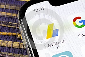 Google AdSense application icon on Apple iPhone X screen close-up. Google AdSense app icon. Google AdSense application. Social med