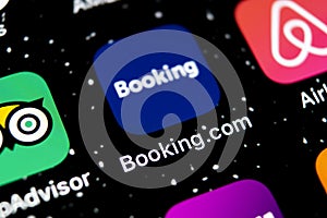 Booking.com application icon on Apple iPhone X screen close-up. Booking app icon. Booking.com. Social media app. Social network