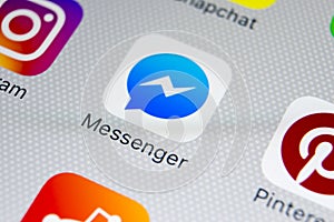 Facebook messenger application icon on Apple iPhone X screen close-up. Facebook messenger app icon. Online internet social media