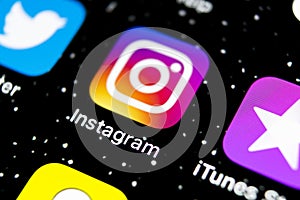 Instagram application icon on Apple iPhone X smartphone screen close-up. Instagram app icon. Social media icon. Social network