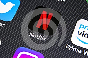 Netflix application icon on Apple iPhone X screen close-up. Netflix app icon. Netflix application. Social media network