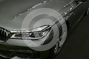 Front view headlight of a BMW 750 G11G12 7-series. Car exterior details.