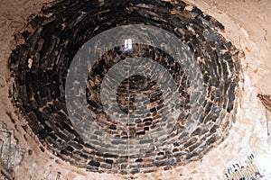 Sanli Urfa, Turkey- September 12 2020: View over the dome of a mud brick house from inside, in the village of Harran