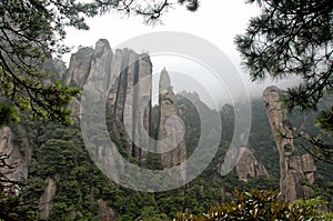 Sanqingshan Mountain in Jiangxi Province, China. Misty mountain scenery with rocky peaks on Mount Sanqing