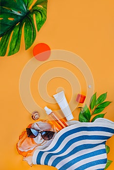 Sanscreen. Beach set: hat, sun glasses and protection cream SPF Beach accessories. Summer Travel Vacation Concept photo