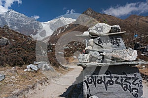 Sanskrit mantra rock carving leading Langtang Lirung