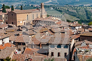 Sant Agostino church and houses rooftops at San Gimignano