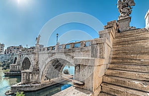 Sant Angelo bridge under a shining sun in Rome