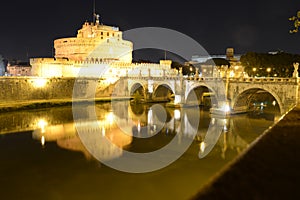 Sant Angelo castle on Tevere river at night, Rome, Italy photo