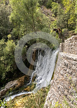 Sant`Angelo a Fasanella. View of the crossbar of the ancient power plant. Artificial waterfall at the sources of the Auso