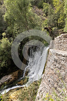 Sant`Angelo a Fasanella. View of the crossbar of the ancient power plant. Artificial waterfall at the sources of the Auso