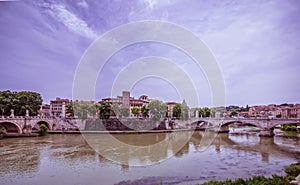 Sant\'Angelo and Vittorio Emanuele II bridges on Tiber river panoramic view under impressive sky. photo