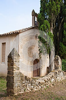 Sant Miquel del Castell chapel with cypress trees