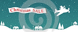 Santa in airplane flying above the houses with aero advertisement of Christmas SALE, discounts.Winter landscape with fir trees