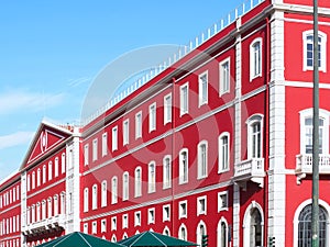 Santa Apolonia station in Lisbon with a shining red facade