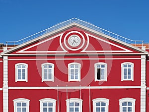 Santa Apolonia station in Lisbon with a shining red facade