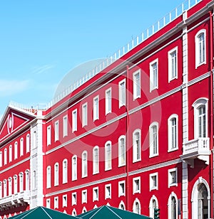 Santa Apolonia station in Lisbon with a shining red facade