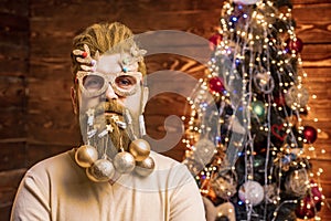 Santa in barbershop. Christmas or New Year barber shop concept. Beard with bauble. Christmas style for modern Santa.