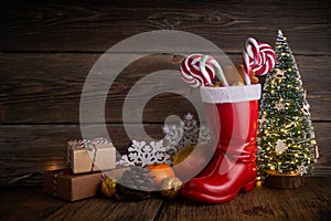 Santa boots with sweets and gifts for St. Nicholas Day on December 6th. photo
